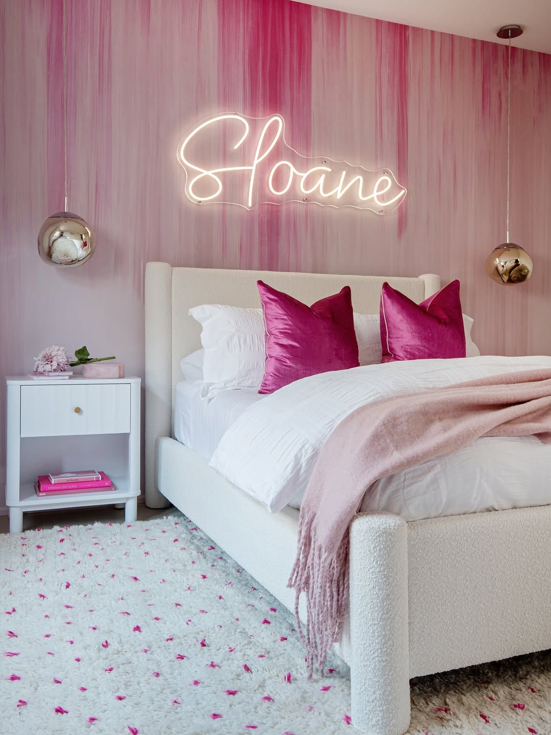 Neon Pink Signs Turned the Bed Wall Into the Main Feature