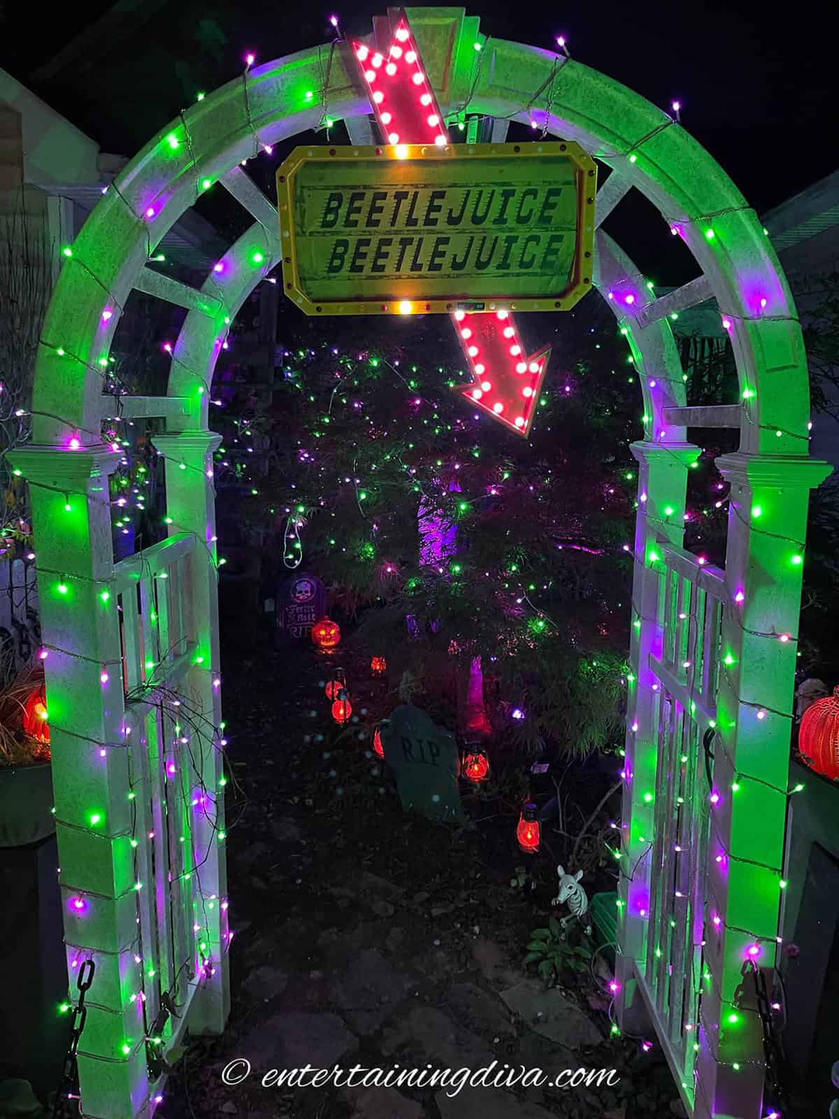 Blinking Beetlejuice marquee sign and lit up archway.